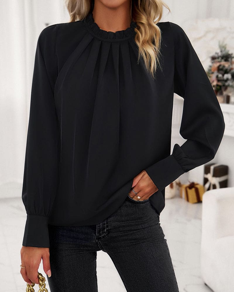 Elegant bluse med flæser