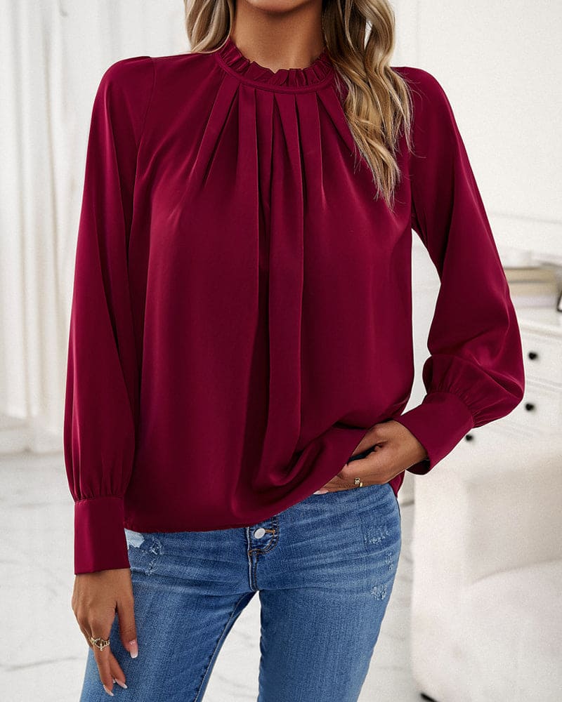 Elegant bluse med flæser