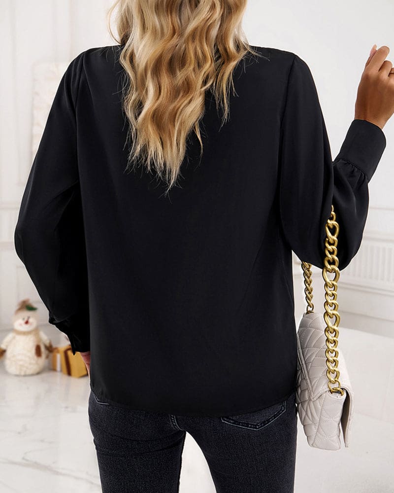 Elegant bluse med flæser