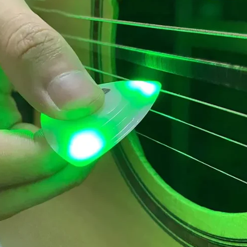 Lysende guitarplekter med rytme effekt