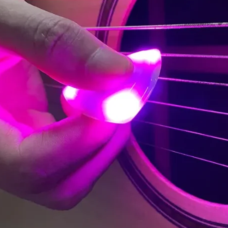 Lysende guitarplekter med rytme effekt