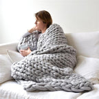 Chunky strikket tæppe til sofa